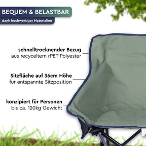 Graugrüner Camping-Faltstuhl mit Stoffbezug, schwarzem Metallgestell und breiter Sitzfläche auf einer Wiese. - LAJA | Camping-Faltstuhl - Tambu Outdoor